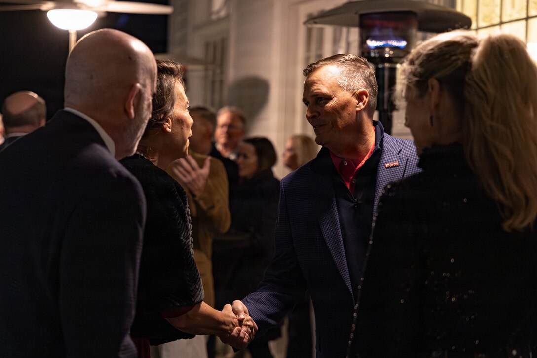 U.S. Marine Corps Lt. Gen. Leonard F. Anderson IV, commander of Marine Forces Reserve and Marine Forces South, welcomes guests as they arrive for the annual Christmas party held at Quarters A in New Orleans, Dec. 6, 2025. The event supported the Marine Corps Reserve Toys for Tots program, with guests contributing donations throughout the evening, and featured a concert by the Marine Forces Reserve Band as its main attraction. (U.S. Marine Corps photo by Lance Cpl. Priscilla Flores)