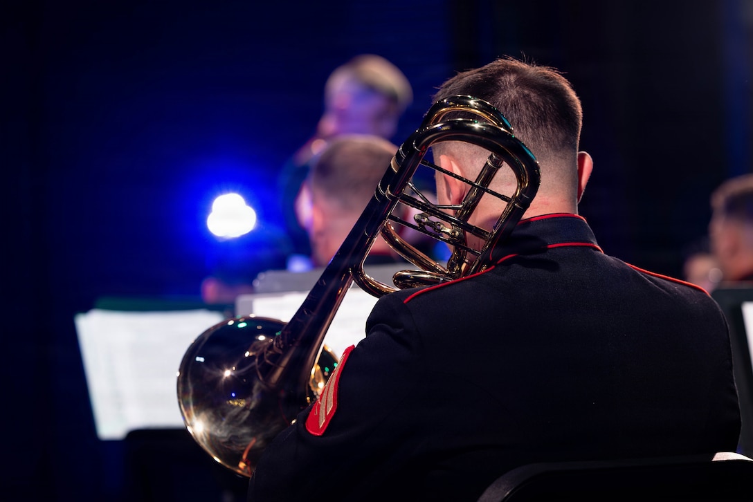 U.S. Marine Corps Cpl. Sean Hawkins, a bass trombonist with the Marine Forces Reserve Band, plays the bass trombone at the Morgan City Municipal Auditorium, Morgan City, Louisiana, Dec. 9, 2025. The Marine Forces Reserve Band performed for the local community to listen to holiday music in the areas surrounding New Orleans while supporting the collecting of new, unwrapped toys for Toys for Tots. (U.S. Marine Corps photo by Lance Cpl. Priscilla Flores)