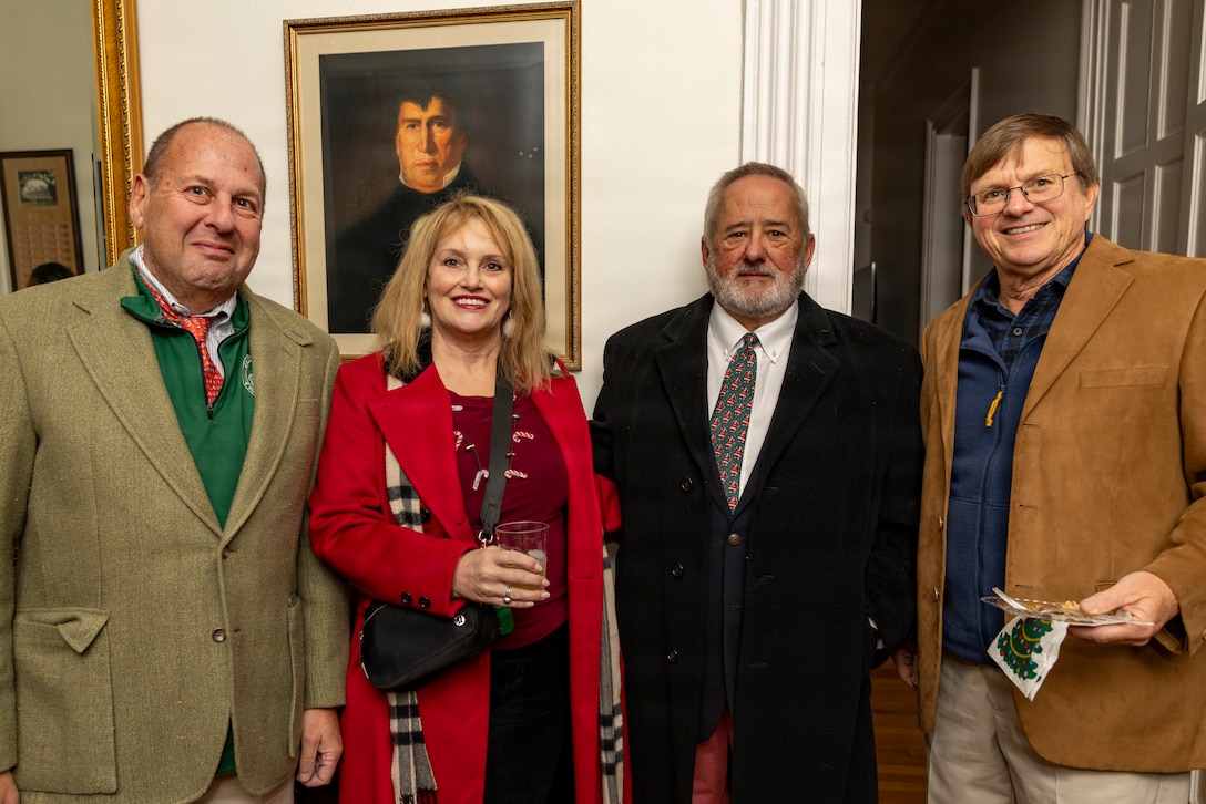 Guests pose for a photo during the Christmas party hosted by the Commander of Marine Forces Reserve and Marine Forces South at Quarters A in New Orleans, Dec. 6, 2025. The event supported the Marine Corps Reserve Toys for Tots program, with attendees contributing donations throughout the evening. (U.S. Marine Corps photo by Sgt. Samuel Qin)