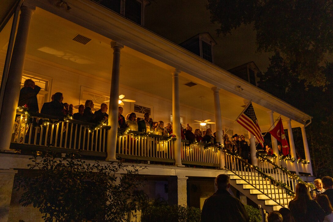 Guests watch the Marine Forces Reserve Band perform during the Christmas party hosted by Lt. Gen Leonard F. Anderson IV, commander of Marine Forces Reserve and Marine Forces South, at Quarters A in New Orleans, Dec. 6, 2025. The event supported the Marine Corps Reserve Toys for Tots program, with attendees contributing donations throughout the evening. (U.S. Marine Corps photo by Sgt. Samuel Qin)