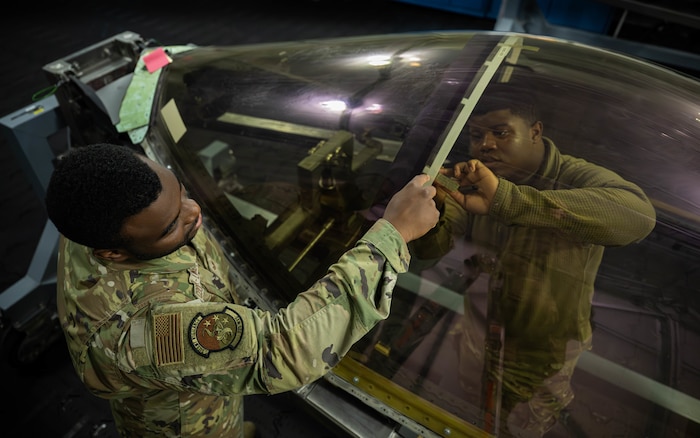 U.S. Airmen sensile marks on an F-35A Lightning II aircraft