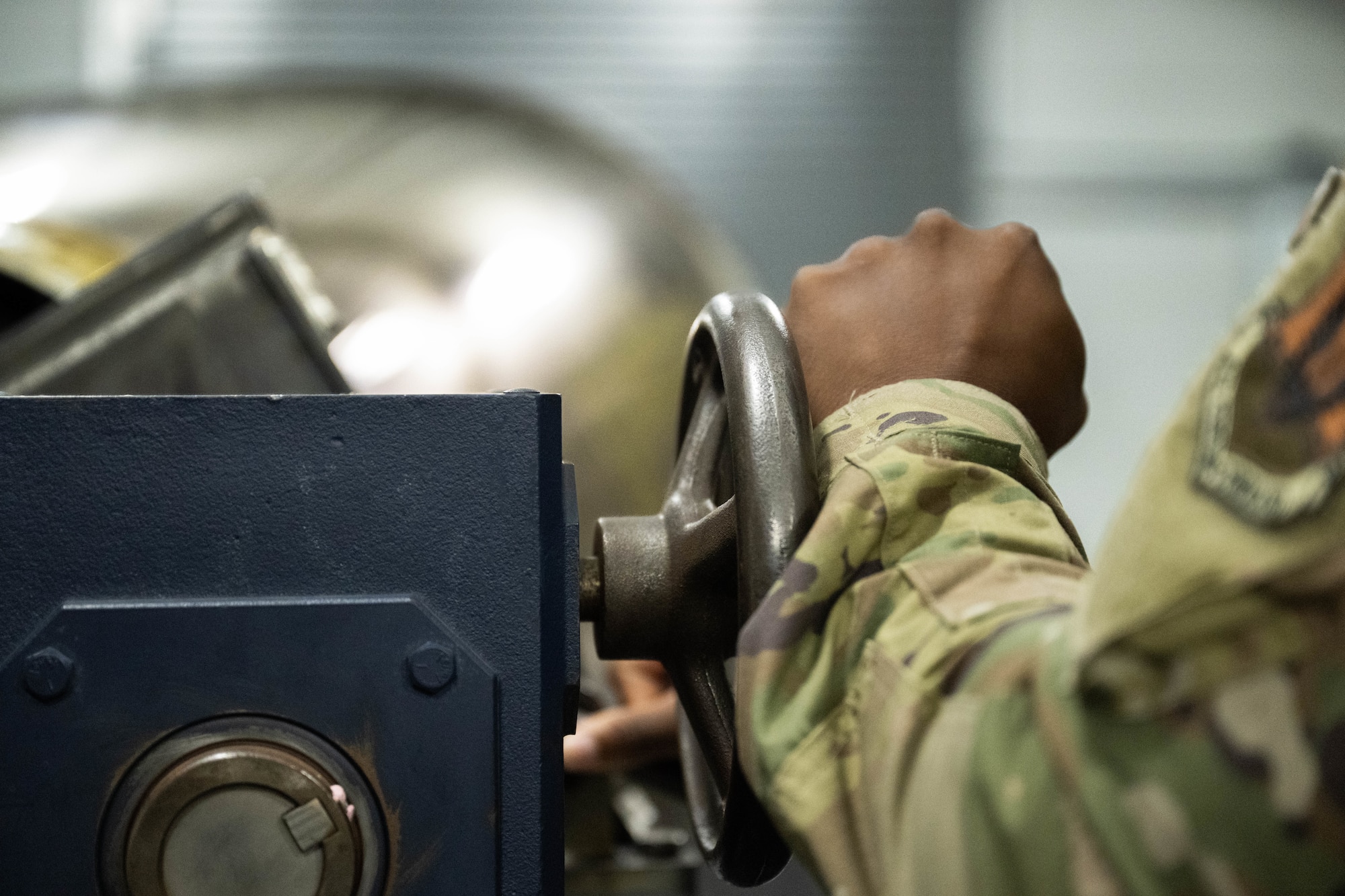 U.S. Airman rotates an F-35A Lightning II canopy during flexible linear shaped charge training