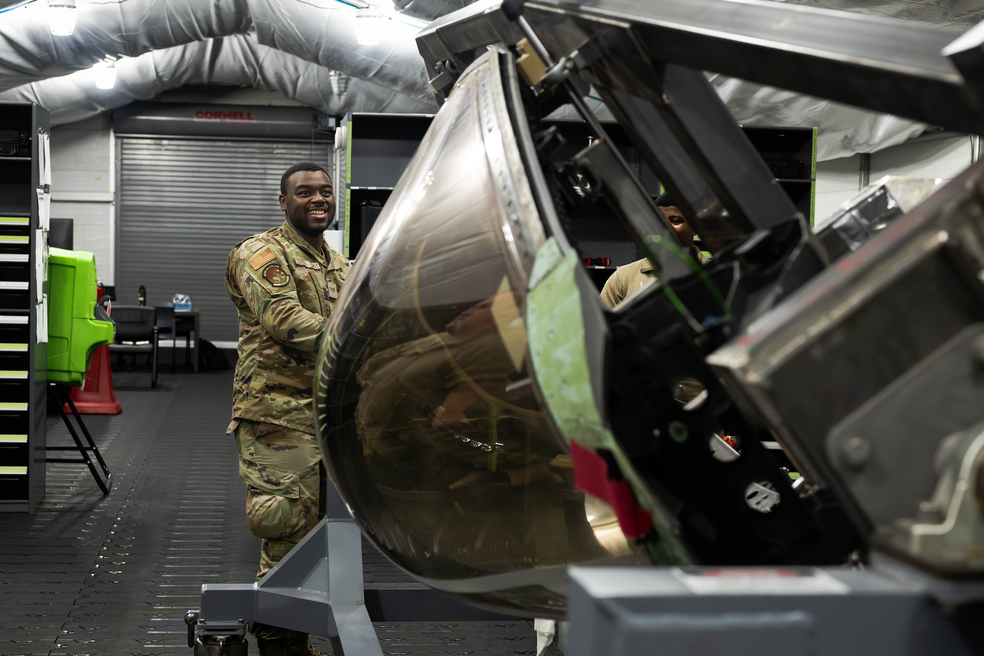 U.S. Air Force Airman turns over canopy