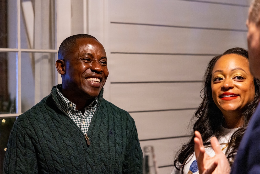 U.S. Marine Corps Sgt. Maj. Kabiru Labaran, command senior enlisted leader, Headquarters Battalion, Marine Forces Reserve and Marine Forces South, mingles with guests at the annual Christmas party held at Quarters A in New Orleans, Dec. 6, 2025. The event supported the Marine Corps Reserve Toys for Tots program, with guests contributing donations throughout the evening, and featured a concert by the Marine Forces Reserve Band as its main attraction. (U.S. Marine Corps photo by Sgt. Samuel Qin)