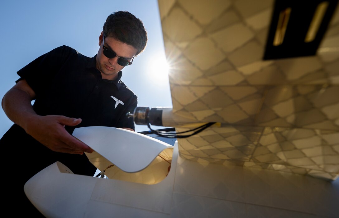 Noah Benton, Titan Dynamics chief technology officer, prepare a 3-D-printed unmanned aerial system for flight during a demonstration April 25, 2024 at Eglin Air Force Base, Florida.