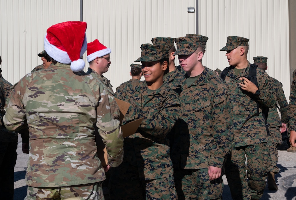 U.S. Marine Corps students receive treats during their lunch break to start off the holiday season