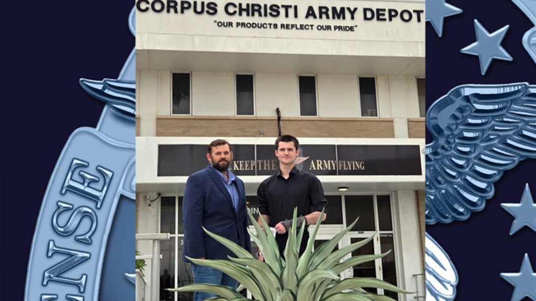 Two men standing in front of a building.