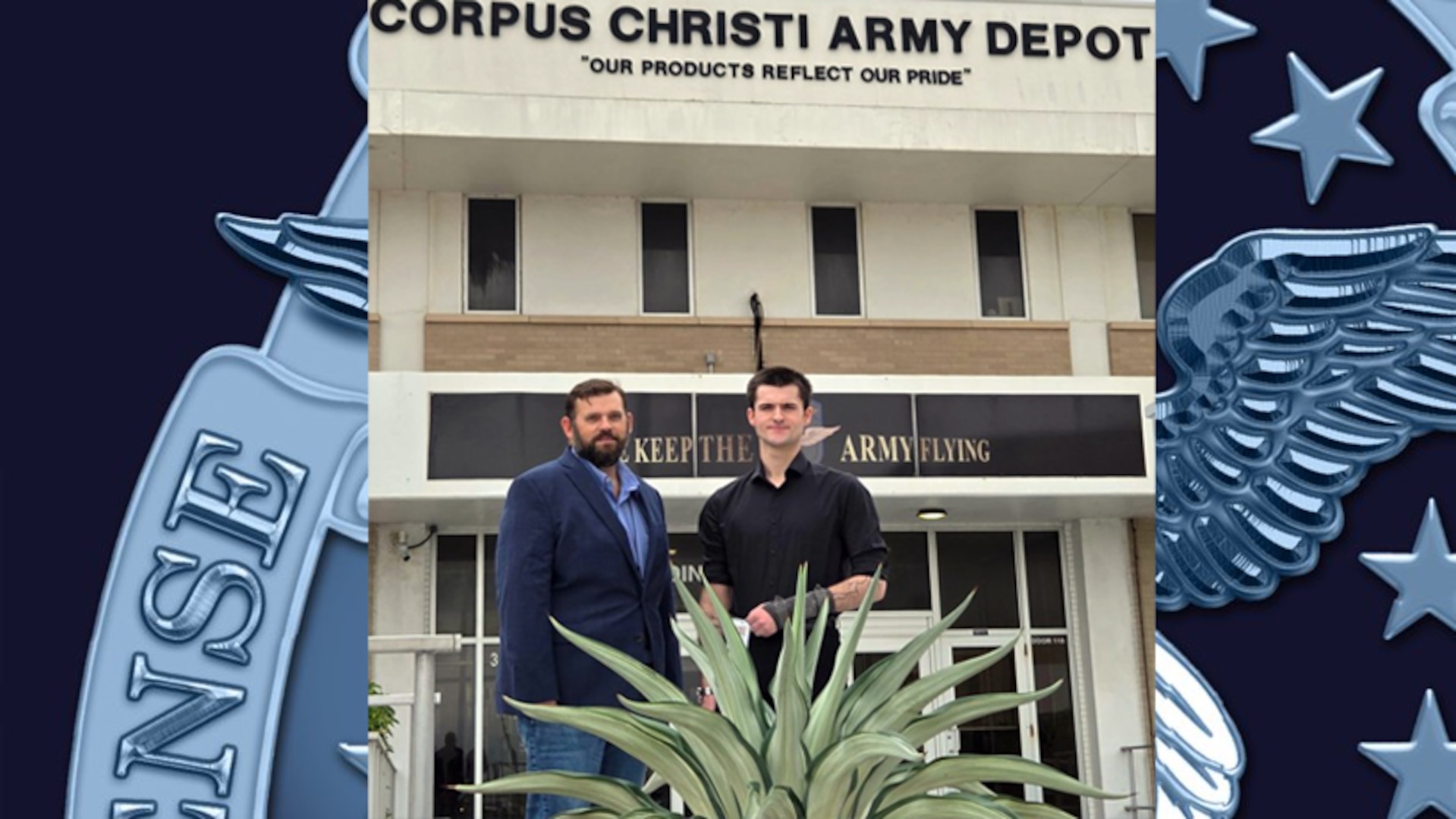 Two men standing in front of a building.