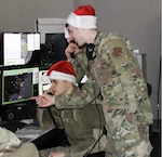 New York Air National Guard Airmen assigned to the Eastern Air Defense Sector in Rome, New York, prepare for their Santa Tracking on Christmas Eve as part of their North American Aerospace Defense Command mission on Dec. 19, 2025. Families can go to NORAD's 