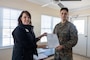 Lauren Bolen, interim director of the American Red Cross, presents Cpl. Zbigniew Adamczyk, Marine Medium Tiltrotor Training Squadron 204, Marine Aircraft Group 26, 2nd Marine Aircraft Wing, with the Red Cross Lifesaving Award on Marine Corps Base Camp Lejeune, North Carolina, Dec. 16, 2025. The Marines received the Lifesaving Award, the second highest award the American Red Cross bestows, for rescuing people during an emergency at a local beach earlier this year. (U.S. Marine Corps photo by Lance Cpl. Erica S. Padgett)