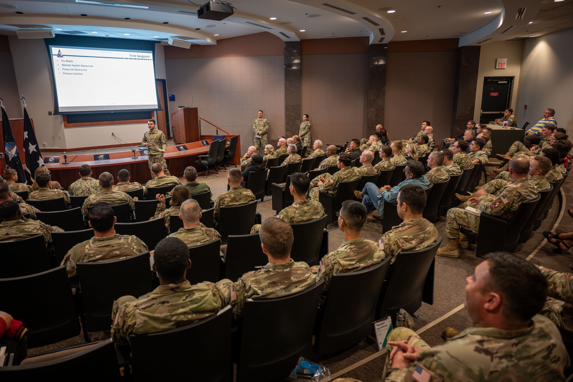 Military leaders speak to soldiers.
