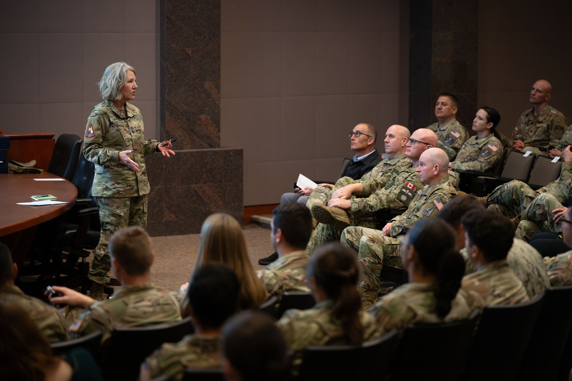 Military leaders speak to soldiers.