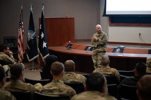 Military leaders speak to soldiers.