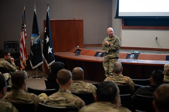 Military leaders speak to soldiers.