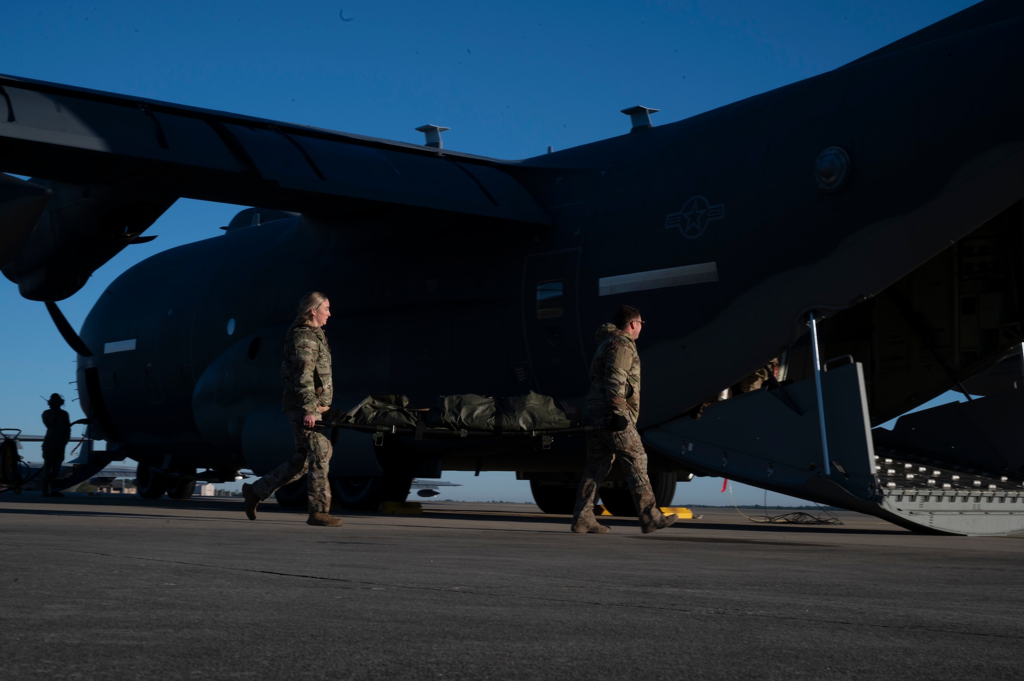 Air Commandos assigned to the 1st Special Operations Wing carry a simulated patient onto a MC-130J Commando II during casualty evacuation training at Hurlburt Field, Florida, Nov. 4, 2025.