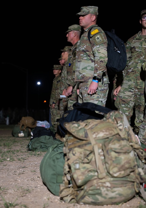 U.S Army soldiers, attached to the 344th Military Battalion, stand in their last formation for accountability before the holidays at the Base Theater, Goodfellow Air Force Base, Texas, Dec. 19, 2025. Christmas Exodus allows students of all services to take leave during the holidays to visit family and other loved ones. (U.S. Air Force photo by Airman 1st Class Maria Mota)