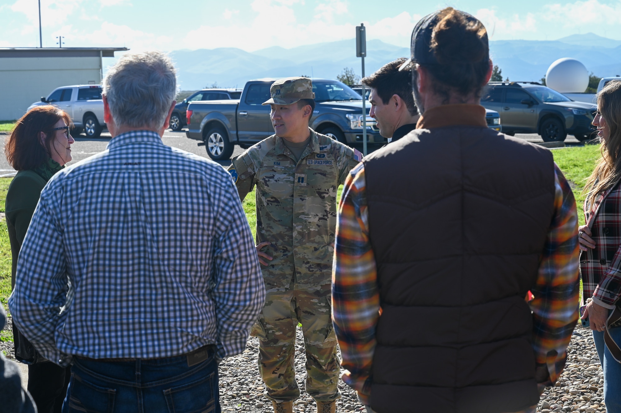 U.S. Space Force Capt. Jeffrey Kim, Vandenberg Remote Launch Control Center mission integration flight commander, speaks to a crowd of people.