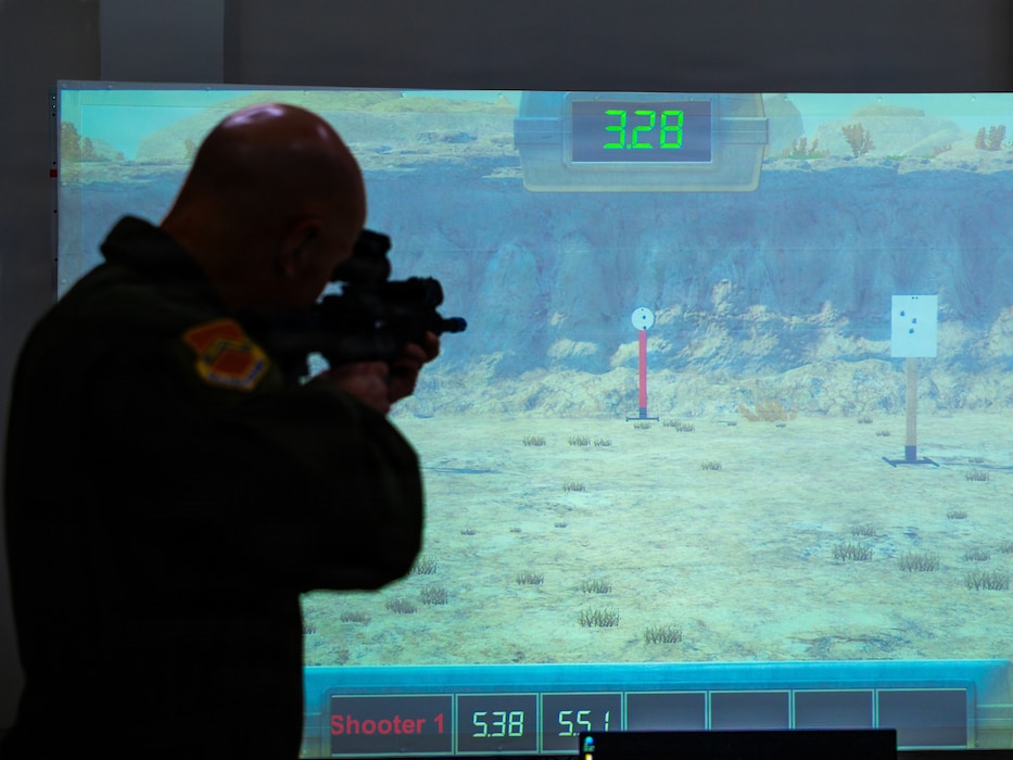 U.S. Air Force Brig. Gen. David Berkland, 56th Fighter Wing commander, completes a shooting challenge on a virtual range simulator during a demonstration, Dec. 15, 2025, at Luke Air Force Base, Arizona.