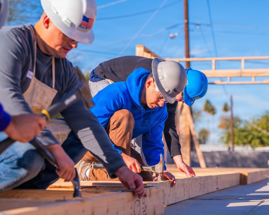 U.S. Air Force Airmen from the 607th Air Control Squadron participate in a Habitat for Humanity volunteer event, Dec. 13, 2025, at Buckeye, Arizona.