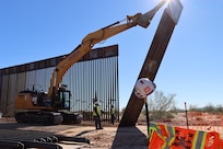 The U.S. Army Corps of Engineers contractors install border panels at the east end of the BMGR-1 project site near Yuma, Arizona, Dec. 16. USACE is replacing permanent border barriers along the southern border of the U.S. at the direction of the U.S. Army by the Secretary of War, in response to the presidential national emergency declaration dated Jan. 20, 2025, authorizing the use of Section 2803 of Title 10, U.S. Code. (no one in this image crossed the international border)