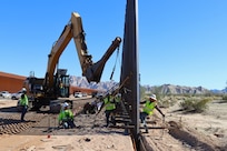 The U.S. Army Corps of Engineers contractors install border panels at the east end of the BMGR-1 project site near Yuma, Arizona, Dec. 16. USACE is replacing permanent border barriers along the southern border of the U.S. at the direction of the U.S. Army by the Secretary of War, in response to the presidential national emergency declaration dated Jan. 20, 2025, authorizing the use of Section 2803 of Title 10, U.S. Code. (no one in this image crossed the international border)