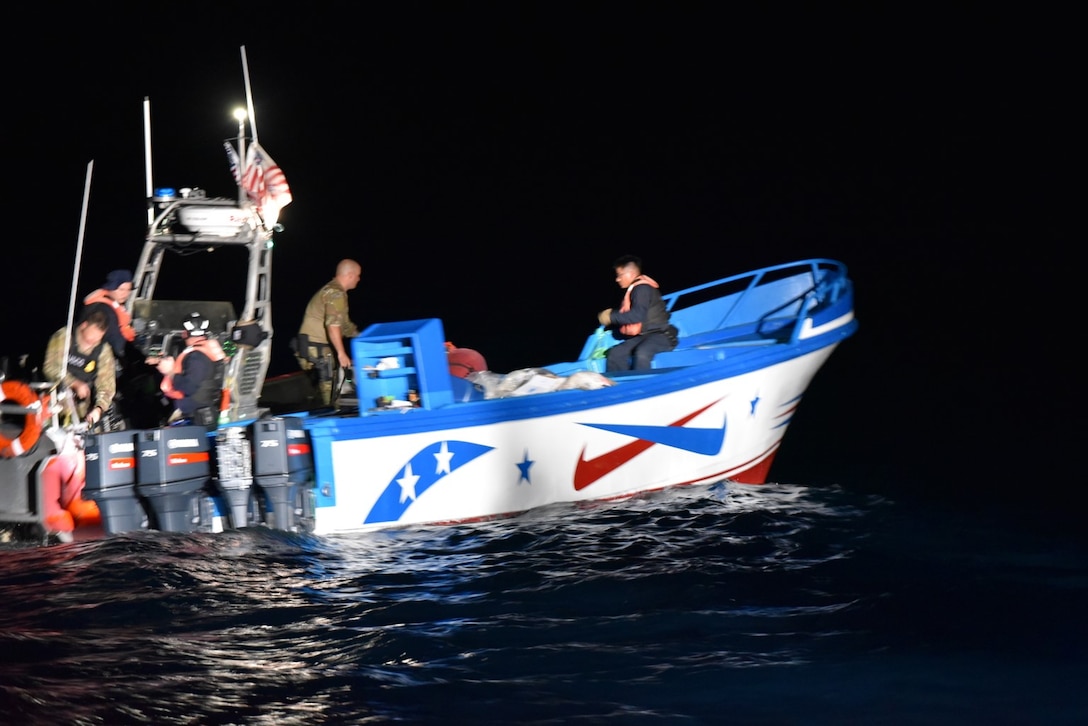 USCGC Active’s (WMEC 618) boarding team pulls alongside a suspected drug smuggling vessel after a 69 mile pursuit while patrolling the Eastern Pacific Ocean, Nov. 25, 2025. Active’s crew seized more than 3,300 pounds of cocaine and detained three suspected drug smugglers during the operation. (U.S. Coast Guard courtesy photo.)