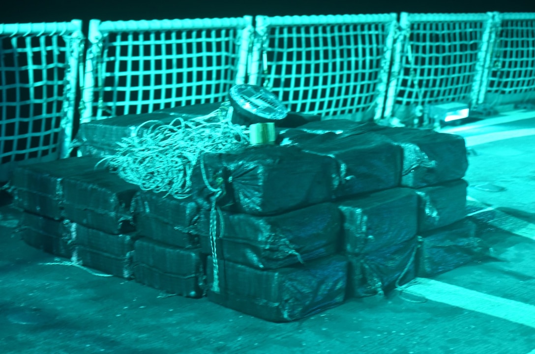 Thirty-three bales of contraband sit on the USCGC Active’s (WMEC 618) flight deck from an interdiction of a suspected drug smuggling vessel while patrolling the Eastern Pacific Ocean, Nov. 25, 2025. Active’s crew seized more than 3,300 pounds of cocaine and detained three suspected drug smugglers during the operation. (U.S. Coast Guard courtesy photo.)