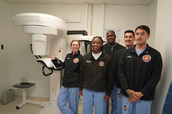 250918-N-FT324-4974. ROTA, Spain (September 18, 2025) – Sailors within the Directorate for Dental Services at U.S. Naval Hospital Rota gather around the command’s new cone beam computed tomography (CBCT) machine. The advanced imaging technology enhances diagnostic capabilities and supports comprehensive dental care for service members and their families. (U.S. Navy photo by Hospital Corpsman Third Class Javier Burgueno)