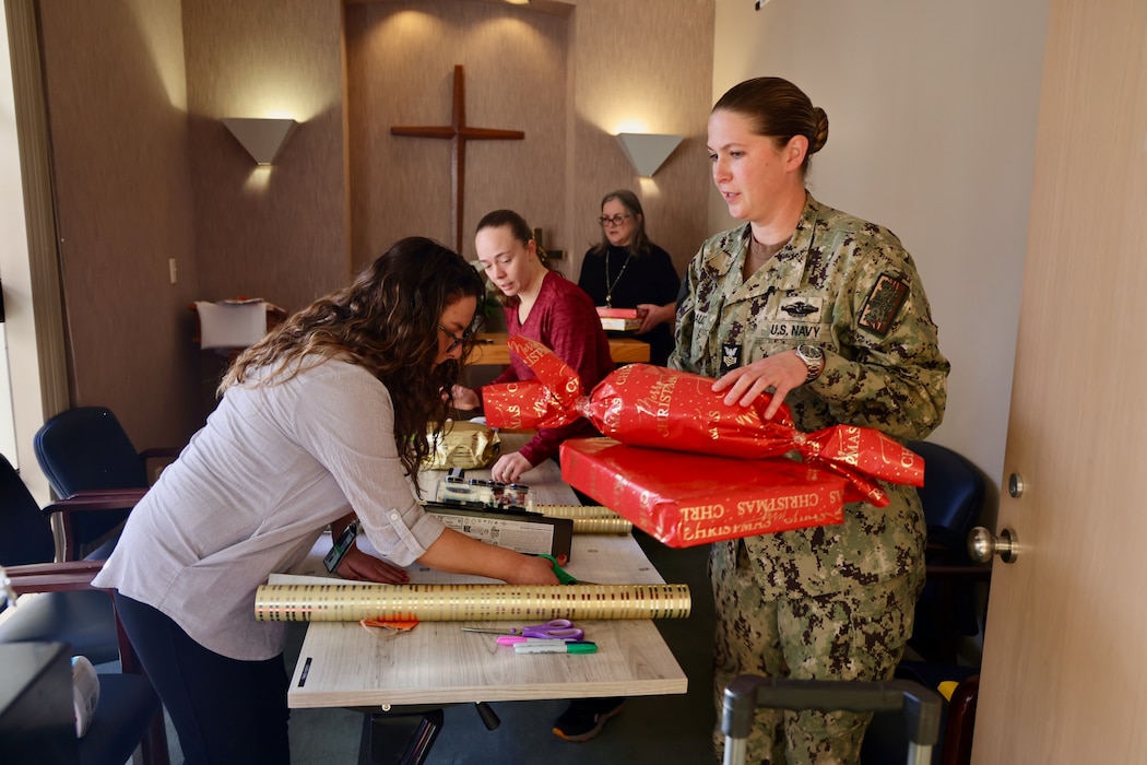 TWENTYNINE PALMS, Calif. (Dec. 17, 2025) — Volunteers from Naval Hospital Twentynine Palms wrap donated holiday gifts as part of the Angel Tree program, a community-driven effort supporting military children and Sailors’ families during the holiday season. (U.S. Navy photo by Christopher Jones/NMRTC Twentynine Palms Public Affairs Officer)