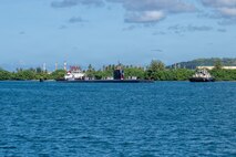Los Angeles-class fast-attack submarine USS Annapolis (SSN 760) transits Apra Harbor, Naval Base Guam, returning to its homeport after completing a routine deployment in the Indo-Pacific, Dec. 19, 2025.