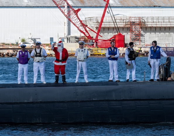 NAVAL BASE GUAM (Dec. 19, 2025) - Los Angeles-class fast-attack submarine USS Annapolis (SSN 760) transits Apra Harbor, Naval Base Guam, returning to its homeport after completing a routine deployment in the Indo-Pacific, Dec. 19, 2025. Assigned to Commander, Submarine Squadron 15 at Polaris Point, Naval Base Guam, Annapolis is one of five fast-attack submarines forward deployed in the Pacific. Renowned for their unparalleled speed, endurance, stealth, and mobility, fast-attack submarines serve as the backbone of the Navy's submarine force, ensuring readiness and agility in safeguarding maritime interests around the world. (U.S. Navy photo by Mass Communication Specialist 1st Class Bryan Mai)