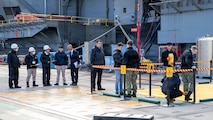 Japanese Nuclear Regulation Authority and U.S. Navy participants simulate radiological surveys on the pier during the U.S.-Japan Joint Drill at Commander, Fleet Activities Yokosuka, Dec. 18, 2025.  The surveys are shared with each other and confirm no radiological impact to the base and environment from the simulated event. The drill, led by Commander, Submarine Group Seven, simulates a medical emergency aboard the nuclear-powered aircraft carrier USS George Washington (CVN 73), emphasizing the precedence medical treatment holds in a joint response. Now in its 18th iteration, this U.S.-Japan Joint Drill demonstrates the integral coordination and cooperation between the U.S. Navy, Government of Japan, and City of Yokosuka that further supports the alliance between our two nations. (U.S. Navy photo by Mass Communication Specialist 3rd Class Kyree Rogers)