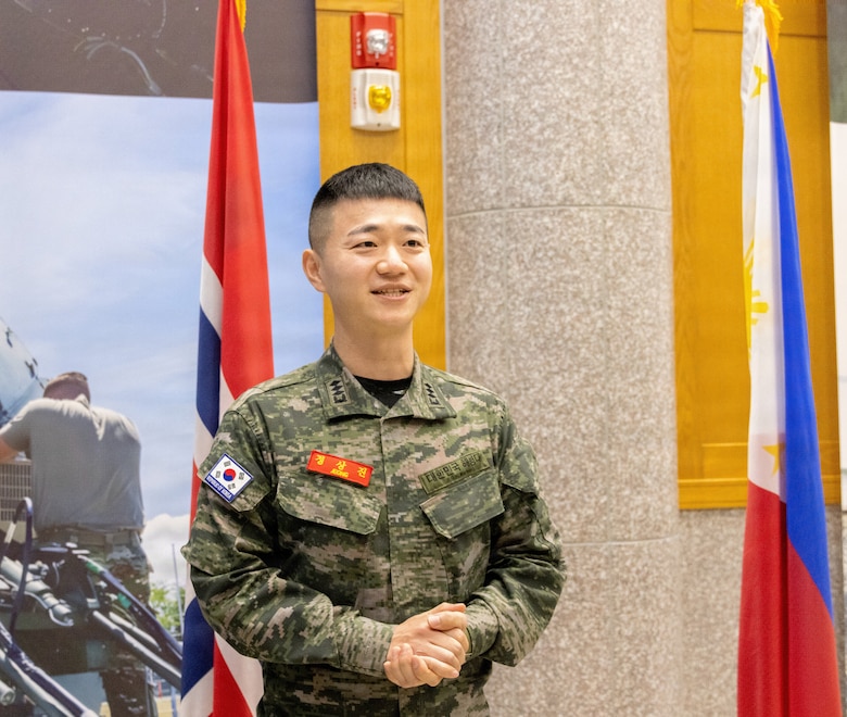 Republic of Korea Marine Corps Capt. Jeong Sang Jin, liaison officer to U.S. Marine Corps Forces, Korea from the ROKMC, addresses Marines with MARFORK during a farewell ceremony on USAG Camp Humphreys, South Korea, Dec. 23, 2025. From Jan. 13 to Dec. 23, 2025, Jeong worked as a critical link in the planning and execution of bilateral ROKMC and MARFORK events. To succeed, he was required to coordinate with staff, balance schedules, and transcend language barriers across warfighting functions and with key leaders in both commands.