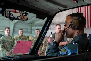 U.S. Air Force Gen. Adrian Spain, commander of Air Combat Command, uses newly implemented radio capabilities at Davis-Monthan Air Force Base, Arizona, Dec. 16, 2025. The ACC command team visited an innovation demonstration where squadrons from across the installation discussed their mission sets and ongoing innovation efforts with Air Combat Command leadership. (U.S. Air Force photo by Senior Airman Jasmyne Bridgers-Matos)