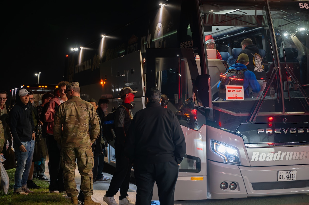 U.S. Air Force students, attached to the 315th Training Squadron, load the buses, ready to start their holiday leave at Goodfellow Air Force Base, Texas, Dec. 19, 2025. For many of these students, it will be the first time in months that they will be seeing family and other loved ones. (U.S. Air Force photo by Airman 1st Class Maria Mota)