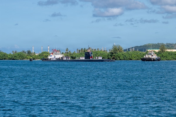 Los Angeles-class fast-attack submarine USS Annapolis (SSN 760) transits Apra Harbor, Naval Base Guam, returning to its homeport after completing a routine deployment in the Indo-Pacific, Dec. 19, 2025.