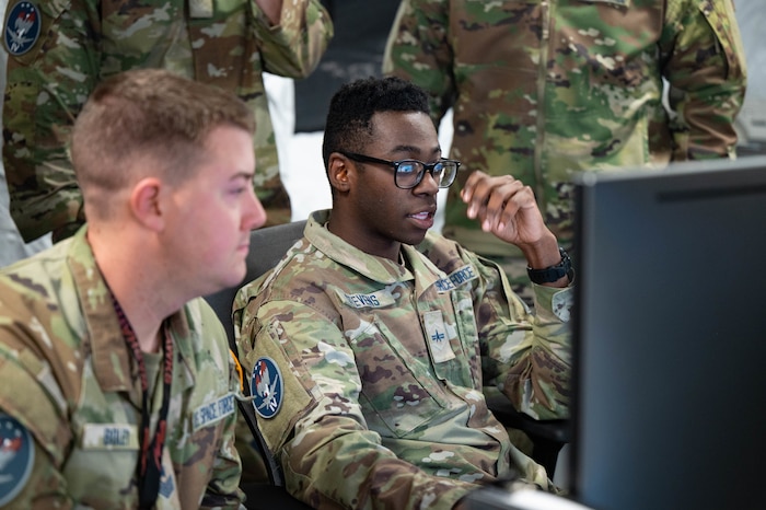 Guardians sitting at desk in uniform