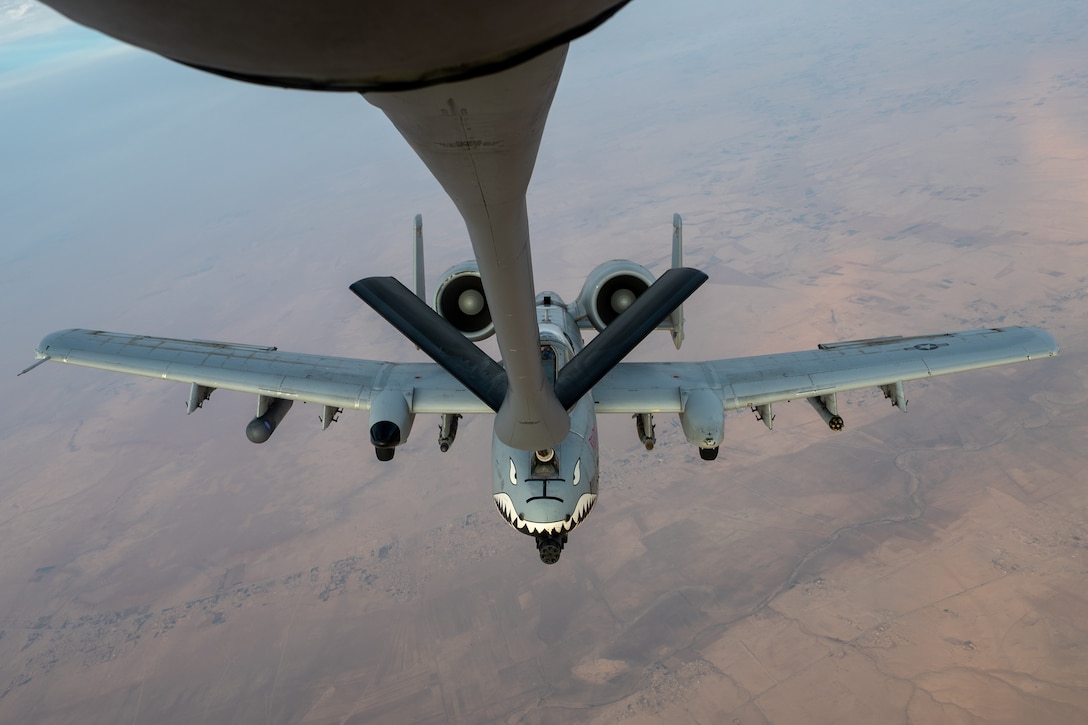 A U.S. Air Force A-10C Thunderbolt II aircraft assigned to the 75th Fighter Squadron receives fuel from a KC-135 Stratotanker aircraft assigned to the 74th Expeditionary Air Refueling Squadron over an undisclosed location within the U.S. Central Command area of responsibility, Nov. 29, 2025. The A-10 conducts operations across the AOR to provide close air support and combat airpower as necessary. (U.S. Air Force photo by Airman 1st Class Travis Knauss)