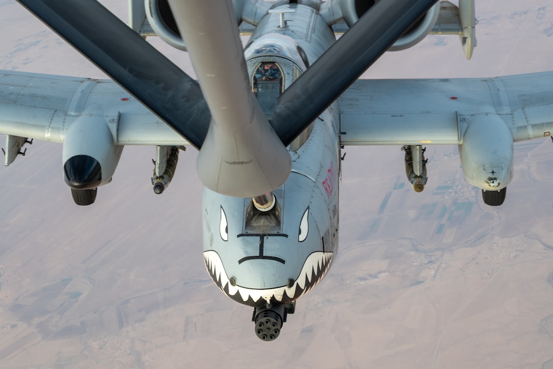 A U.S. Air Force A-10C Thunderbolt II aircraft assigned to the 75th Fighter Squadron receives fuel from a KC-135 Stratotanker aircraft assigned to the 74th Expeditionary Air Refueling Squadron over an undisclosed location within the U.S. Central Command area of responsibility, Nov. 29, 2025. The A-10 conducts operations across the AOR to provide close air support and combat airpower as necessary. (U.S. Air Force photo by Airman 1st Class Travis Knauss)