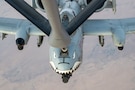 A U.S. Air Force A-10C Thunderbolt II aircraft assigned to the 75th Fighter Squadron receives fuel from a KC-135 Stratotanker aircraft assigned to the 74th Expeditionary Air Refueling Squadron over an undisclosed location within the U.S. Central Command area of responsibility, Nov. 29, 2025. The A-10 conducts operations across the AOR to provide close air support and combat airpower as necessary. (U.S. Air Force photo by Airman 1st Class Travis Knauss)