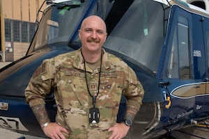 U.S. Air Force Capt. Joshua A. Lemon, 316th Operations Group executive officer, stands in front of a UH-1N Huey helicopter at Joint Base Andrews, Maryland, Sept. 23, 2025. Lemon enlisted in 2003 and reached the rank of senior master sergeant before deciding to continue his career as an officer in 2019.