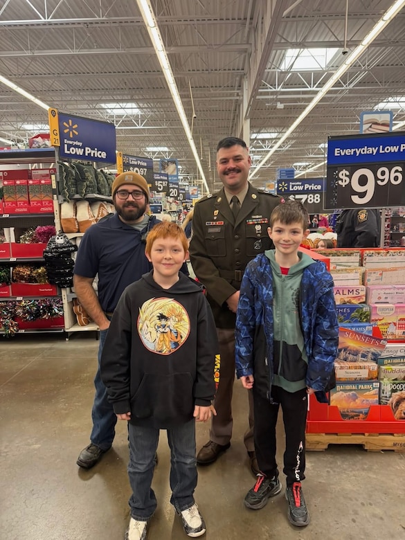 Solider posing with kids.