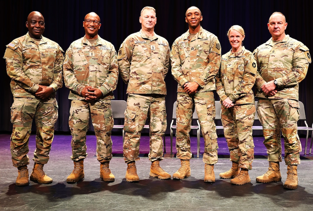 Posing for a photo after the 725th Transportation Company Welcome Home Ceremony.