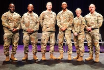 Posing for a photo after the 725th Transportation Company Welcome Home Ceremony.