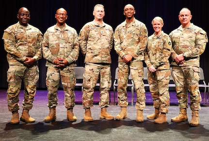 Posing for a photo after the 725th Transportation Company Welcome Home Ceremony.