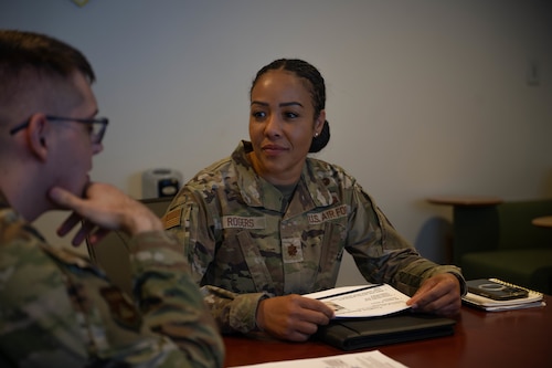 U.S. Air Force Maj. Michelle Rogers, Air Force Mortuary Affairs Operations readiness planner, listens to a Junior Enlisted Foundations 300 student’s response to a lesson at Dover Air Force Base, Delaware, Nov. 18, 2025. The class is a required course for airmen who will be attending Airman Leadership School. (U.S. Air Force photo by Senior Airman Madeline Baisey)