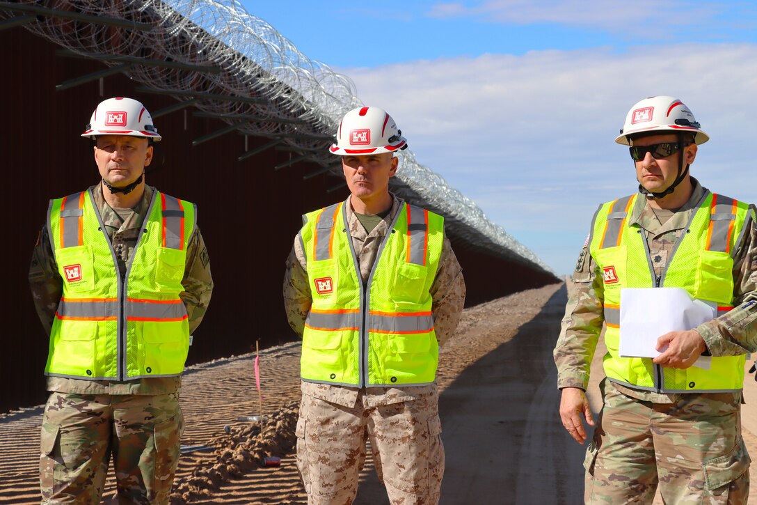 U.S. Army Corps of Engineers Commander Lt. Gen. William Graham, Joint Task Force Southern Border Deputy Commander Marine Corps Brig. Gen. Jeremy Winters, and South Pacific Border Task Force Commander Lt. Col. Jeffrey Beeman monitor border barrier installation progress at the BMGR-1 project site Nov. 17 near Yuma, Arizona. This critical project protects a vital military installation, strengthens border security and the broader southern border mission.