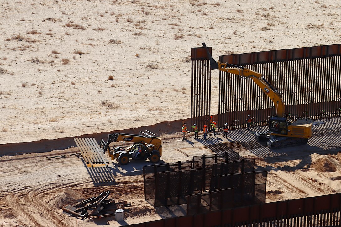 U.S. Army Corps of Engineers South Pacific Border Task Force install border barrier panels at the BMGR-1 project site near Yuma, Arizona, Nov. 17. USACE is replacing permanent border barriers along the southern border of the U.S. at the direction of the U.S. Army by the Secretary of War, in response to the presidential national emergency declaration dated Jan. 20, 2025, authorizing the use of Section 2803 of Title 10, U.S. Code.