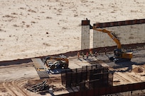 U.S. Army Corps of Engineers South Pacific Border Task Force install border barrier panels at the BMGR-1 project site near Yuma, Arizona, Nov. 17. USACE is replacing permanent border barriers along the southern border of the U.S. at the direction of the U.S. Army by the Secretary of War, in response to the presidential national emergency declaration dated Jan. 20, 2025, authorizing the use of Section 2803 of Title 10, U.S. Code.