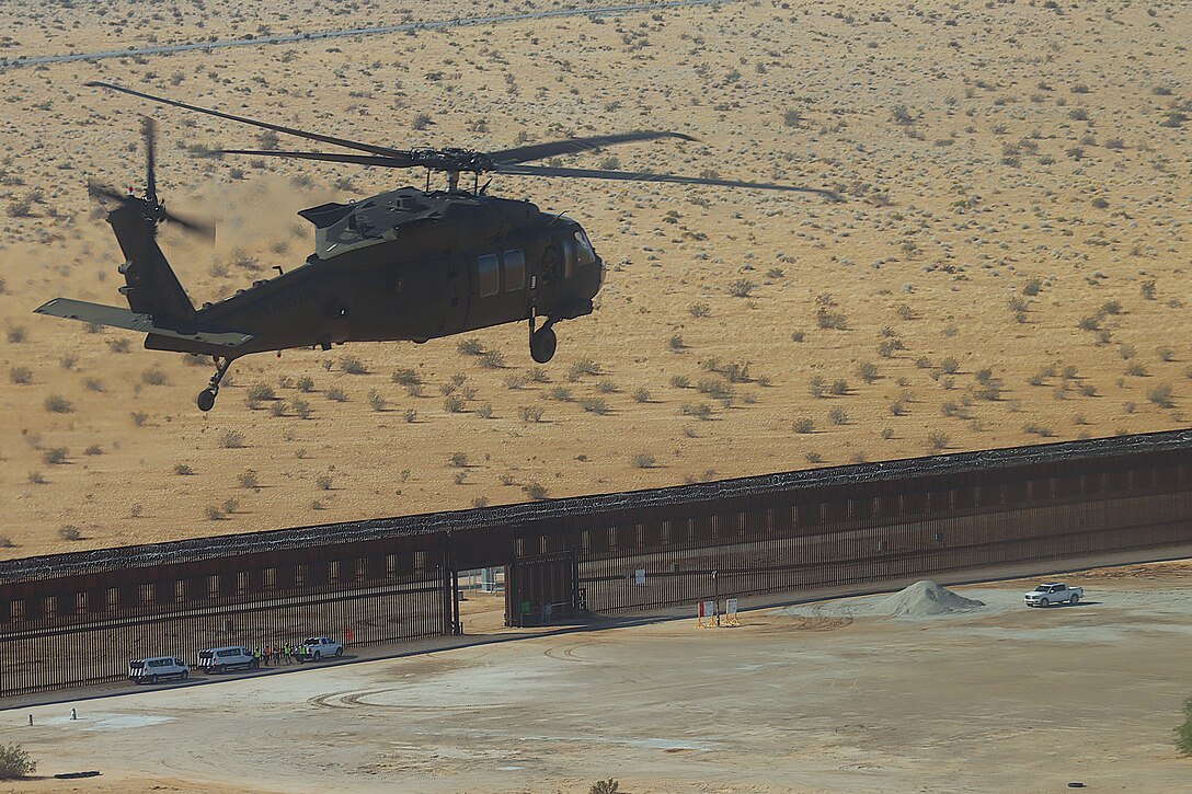 U.S. Army Corps of Engineers South Pacific Border Task Force install border barrier panels at the BMGR-1 project site near Yuma, Arizona, Nov. 17. USACE is replacing permanent border barriers along the southern border of the U.S. at the direction of the U.S. Army by the Secretary of War, in response to the presidential national emergency declaration dated Jan. 20, 2025, authorizing the use of Section 2803 of Title 10, U.S. Code.